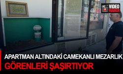 Apartman altındaki camekanlı mezarlık görenleri şaşırtıyor