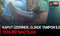 Kaput üzerinde, elinde tampon ile tehlike saçtılar