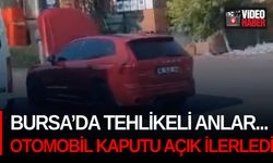 Bursa’da tehlikeli anlar... Otomobil, kaputu açık ilerledi