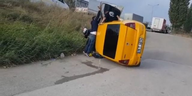 Bursa’da kamyonun sıkıştırdığı taksi takla attı: 2 yaralı