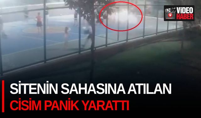 Sitenin sahasına atılan cisim panik yarattı