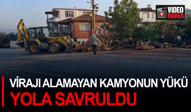 Virajı alamayan kamyonun yükü yola savruldu