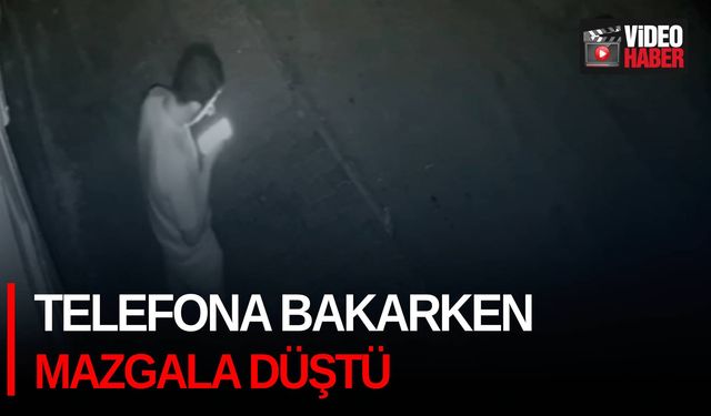 Telefona bakarken mazgala düştü